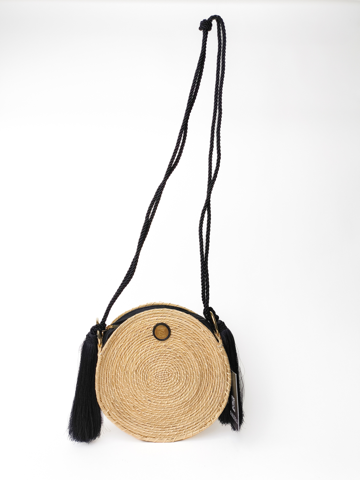 Circlular weaved bag with black string