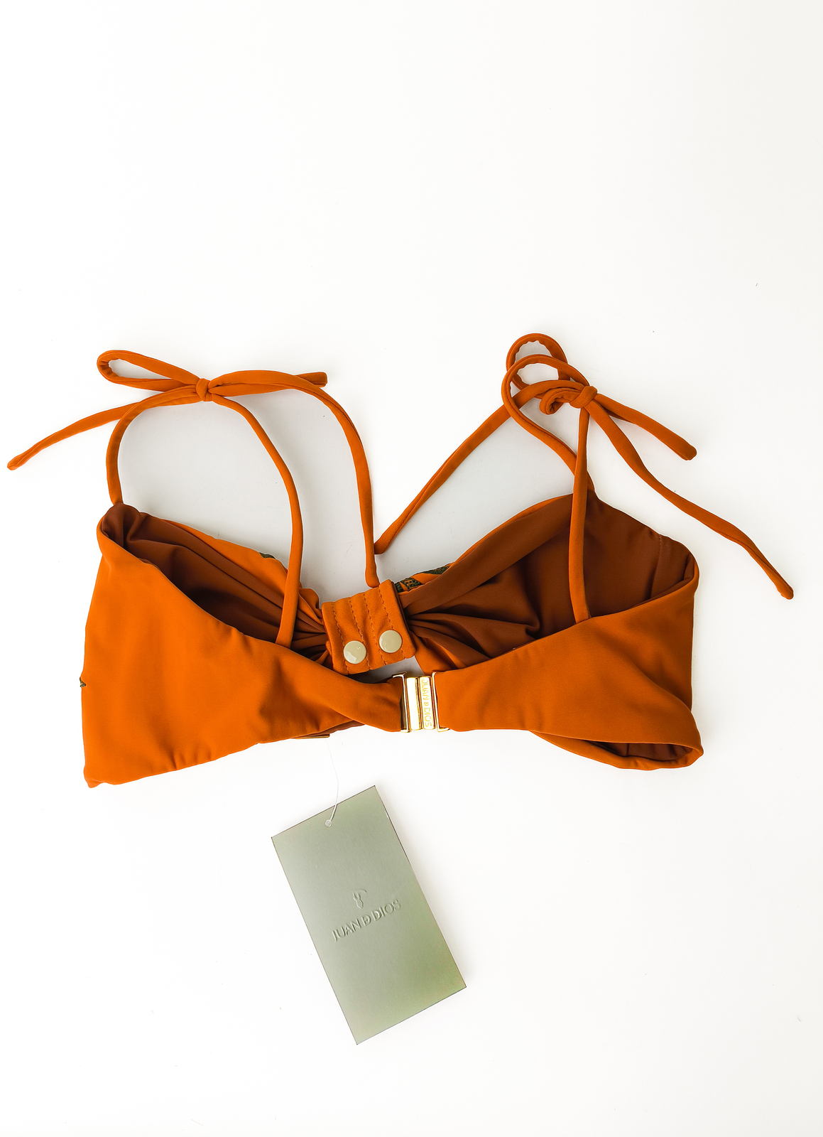 Orange swimsuit top with green embroidery