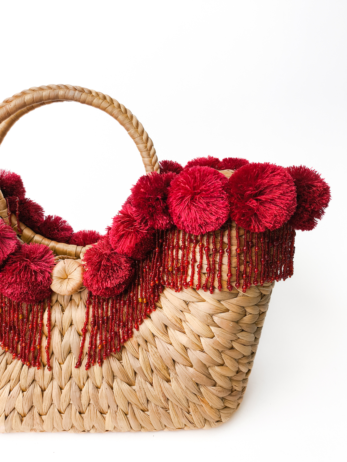 Woven bag with red beading and details