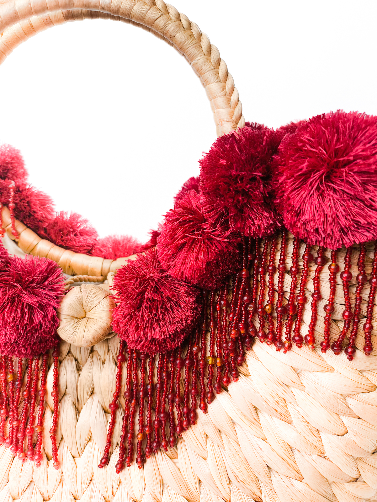 Woven bag with red beading and details