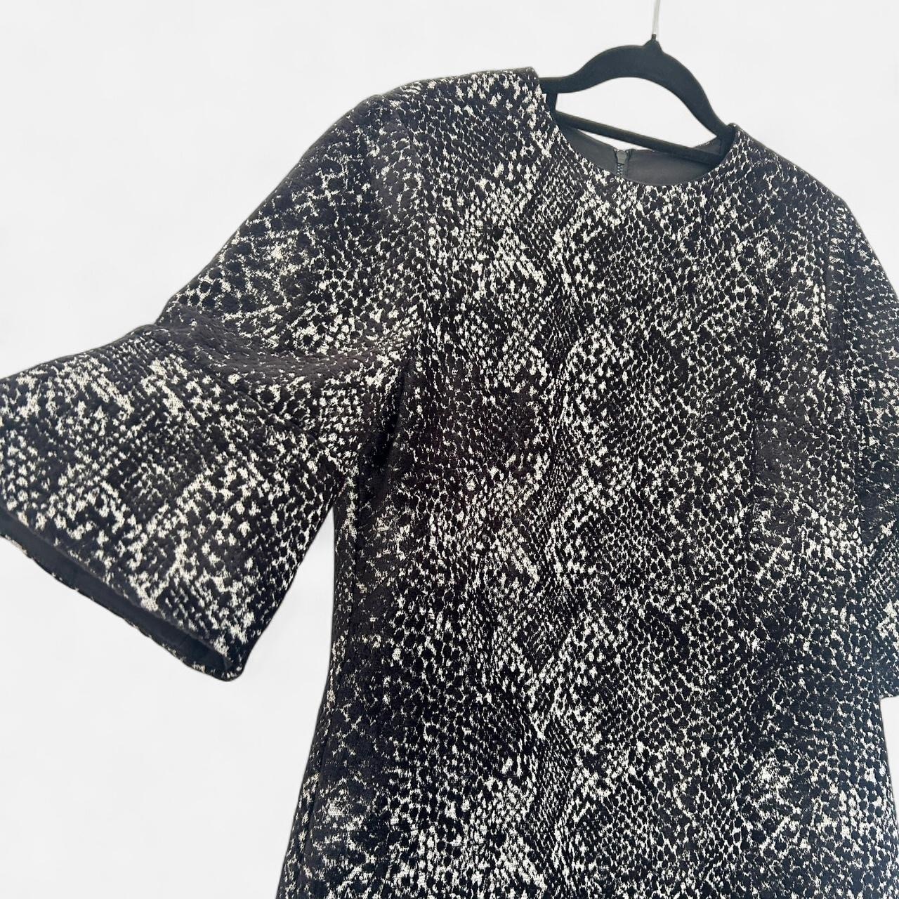 Size 10 black chenille jacquard  with half bell sleeves.