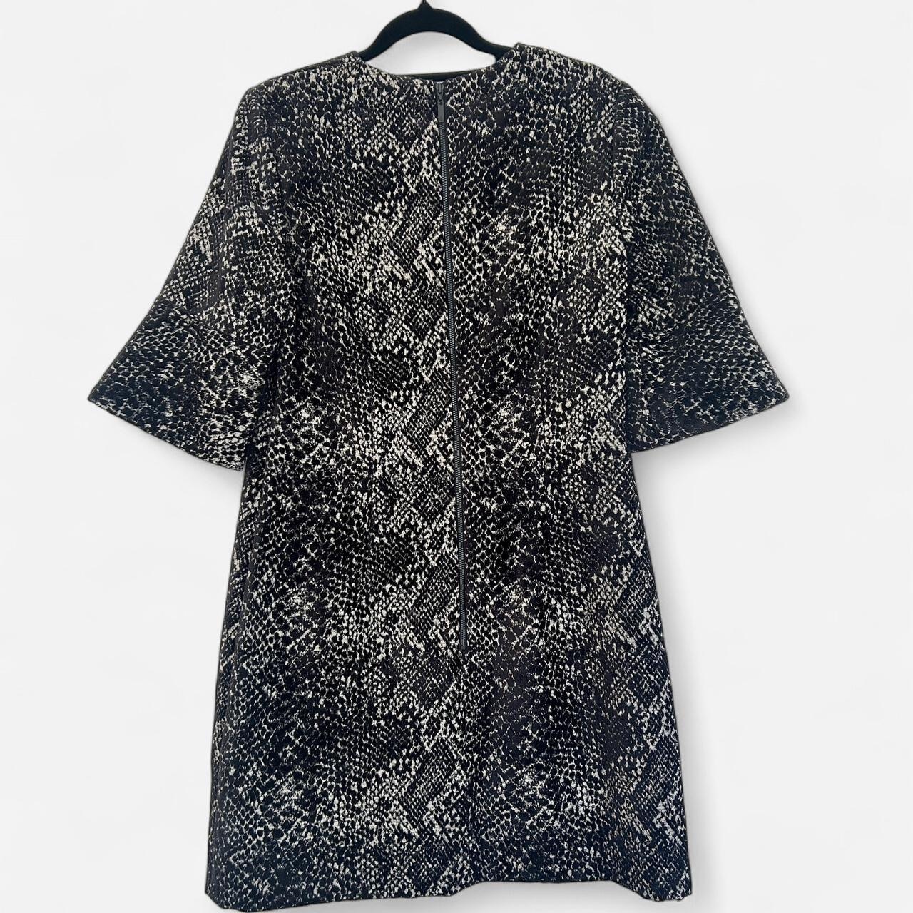 Size 10 black chenille jacquard  with half bell sleeves.