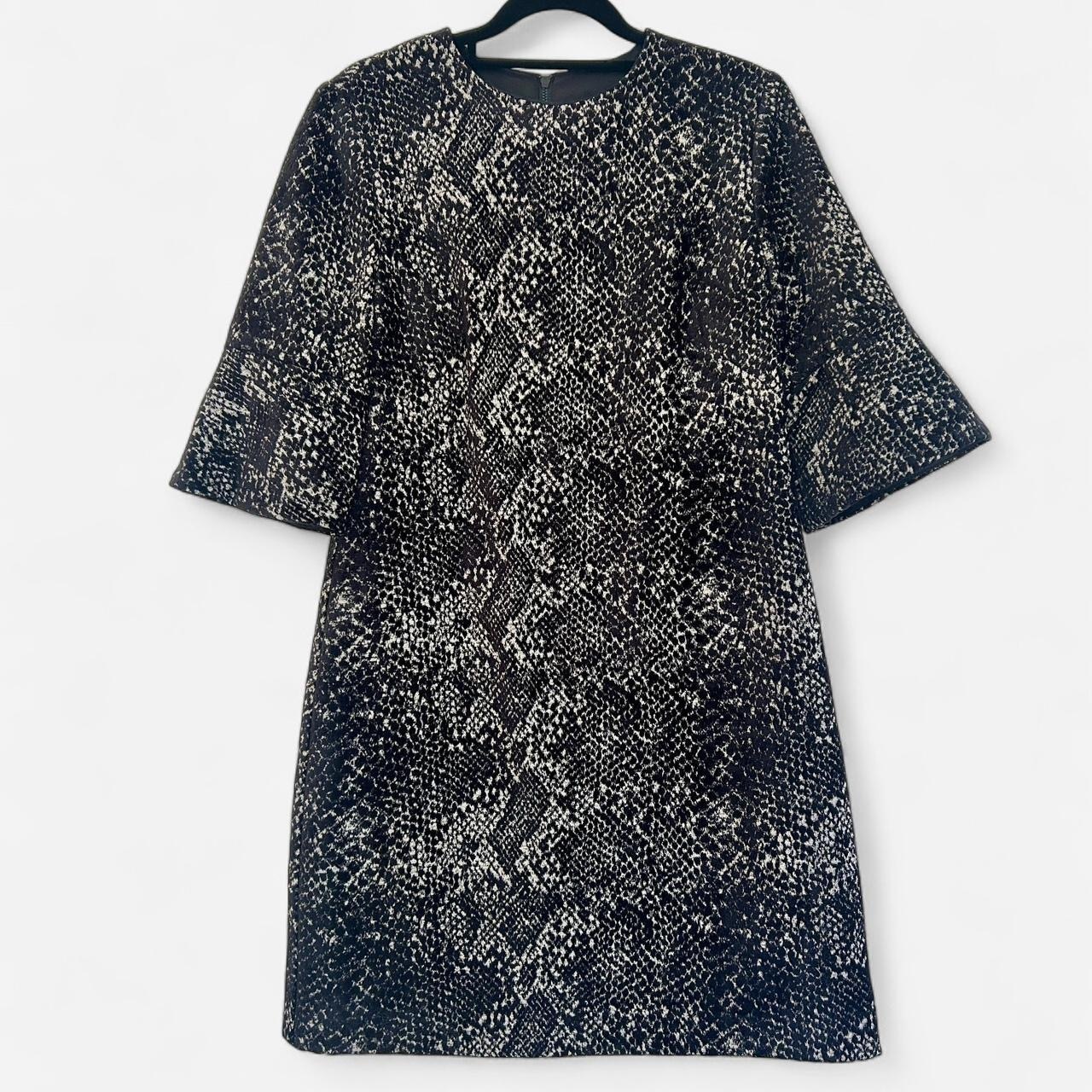 Size 10 black chenille jacquard  with half bell sleeves.