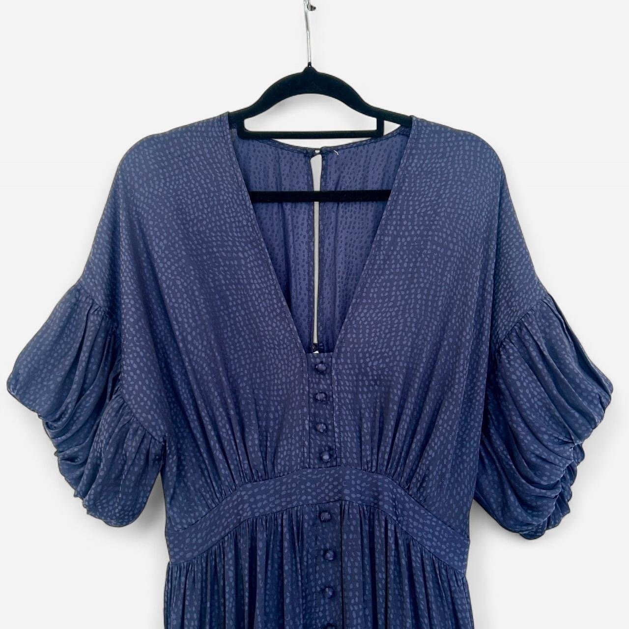 Size 8 navy blue  with puffed sleeves and button up front.