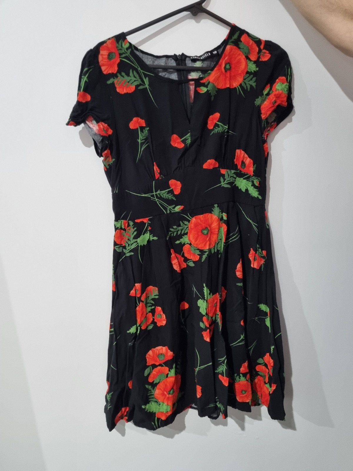 Black dress with red floral print