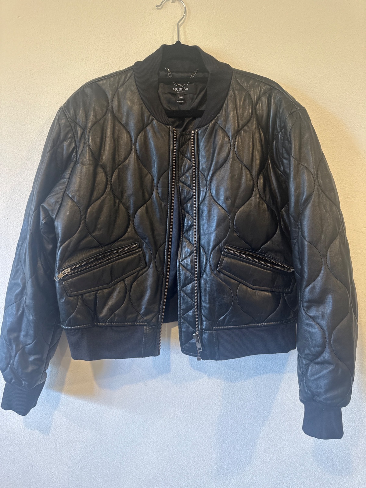 Black quilted bomber jacket with zipper