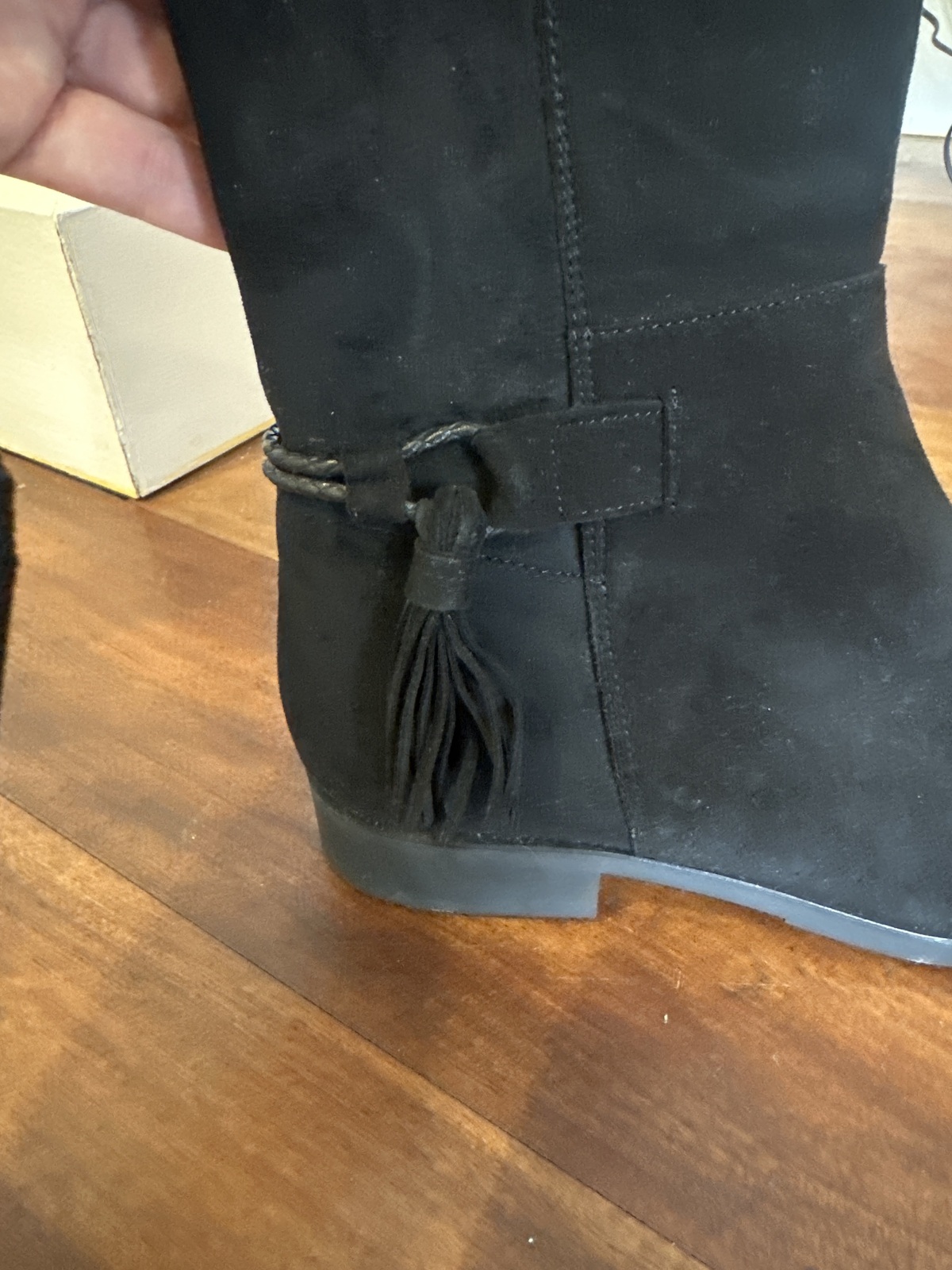 Black suede long boots with tassel detail 