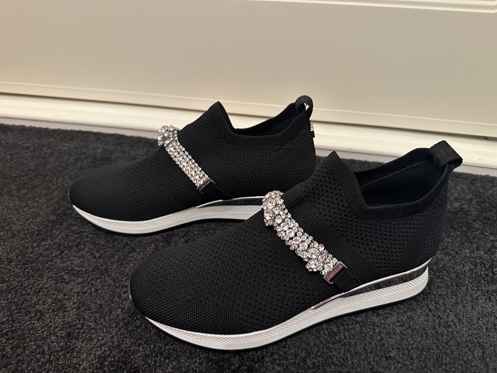 black stretch embellished slip on sneaker