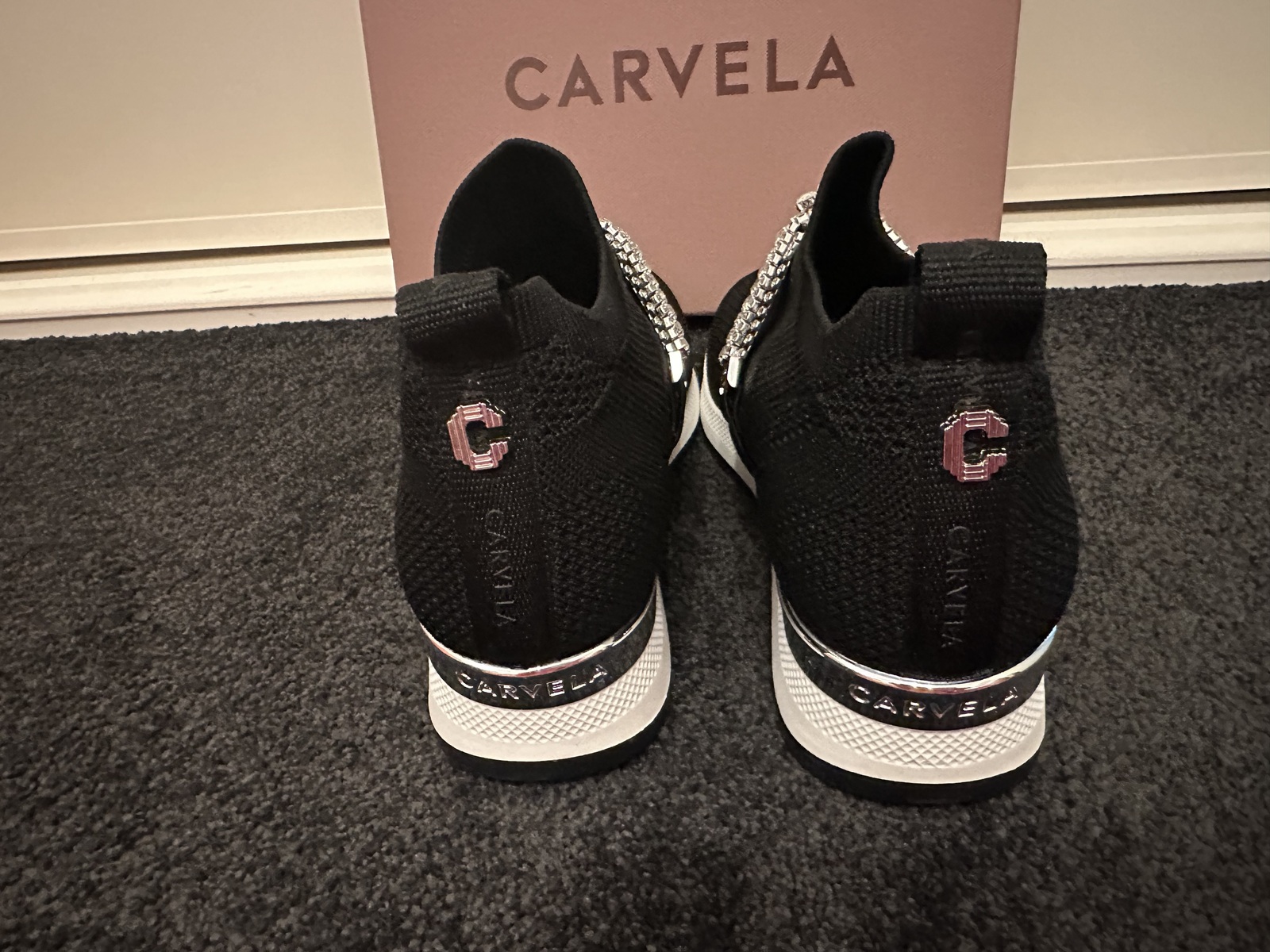 black stretch embellished slip on sneaker