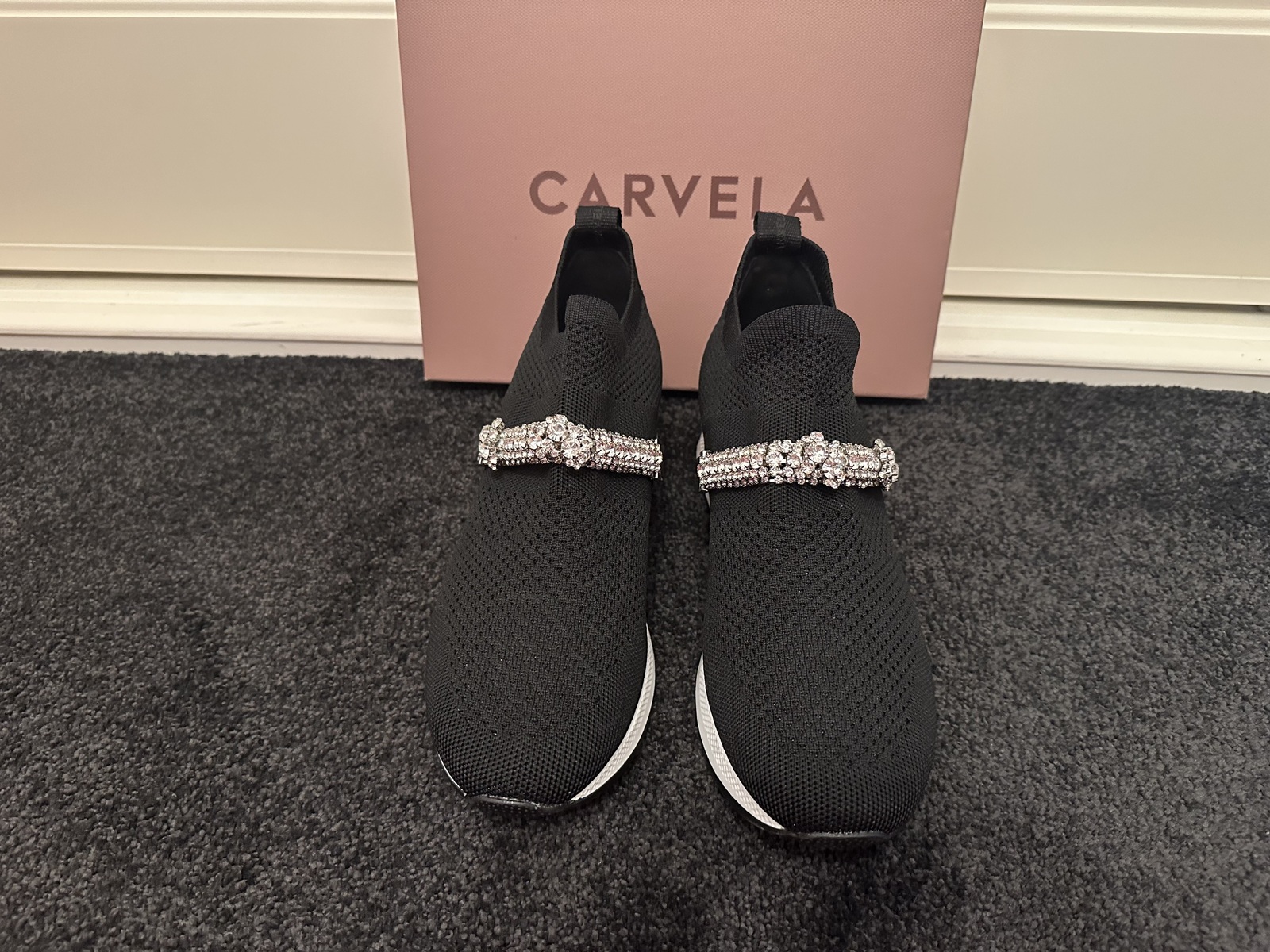 black stretch embellished slip on sneaker