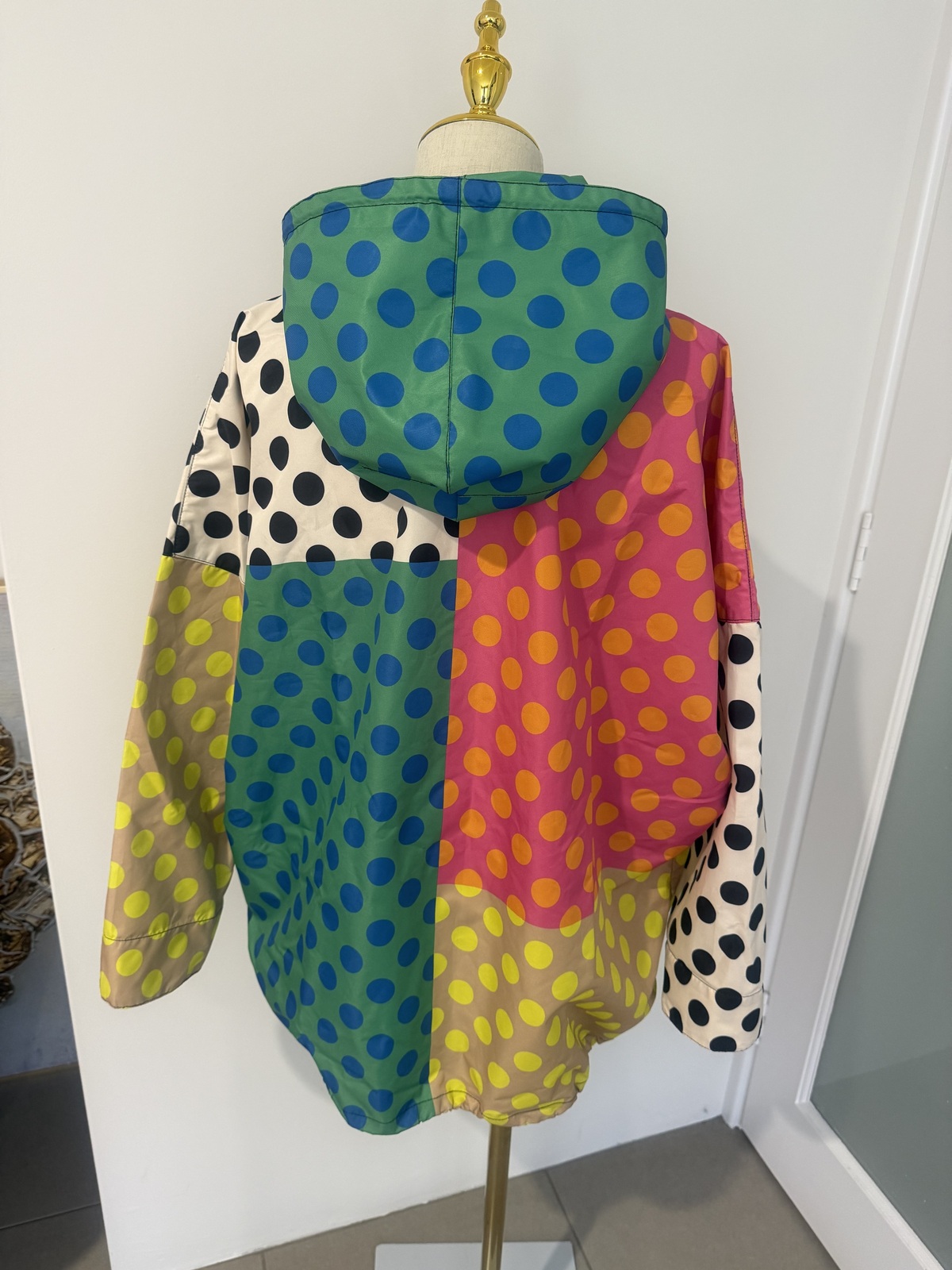 multi coloured raincoat. 