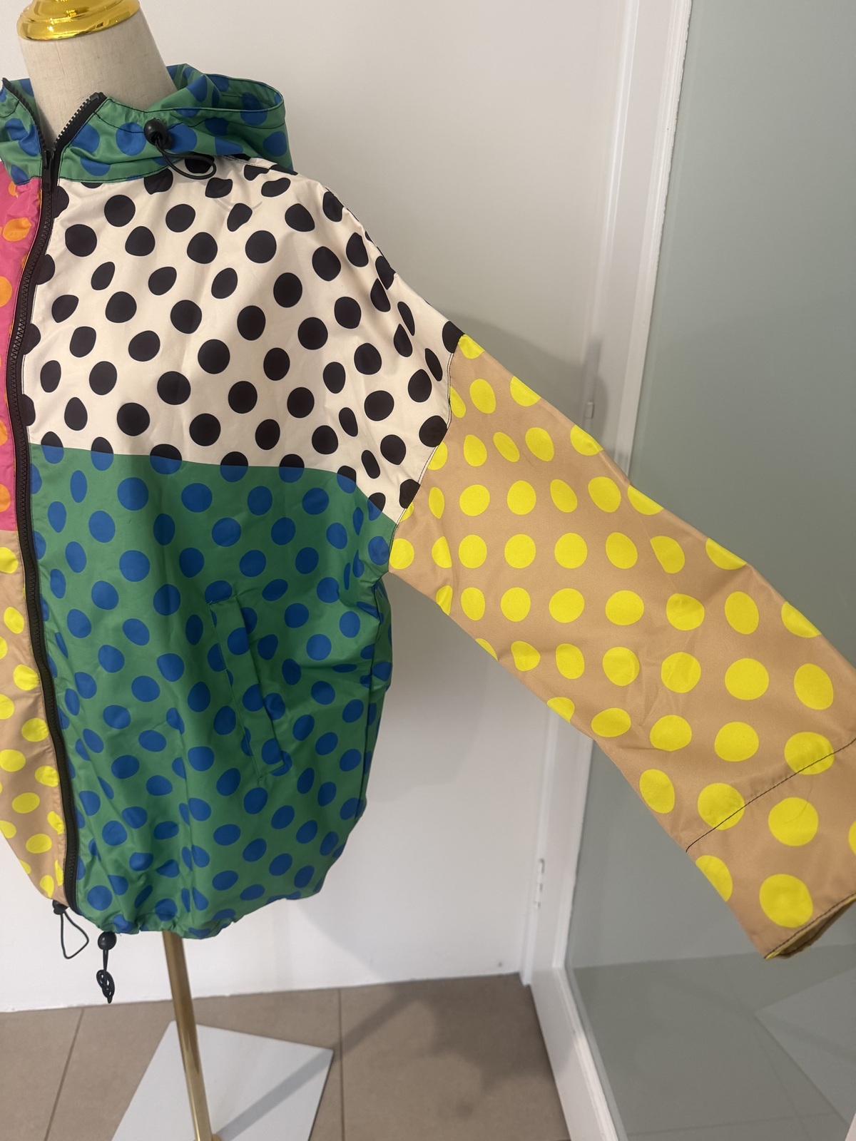 multi coloured raincoat. 