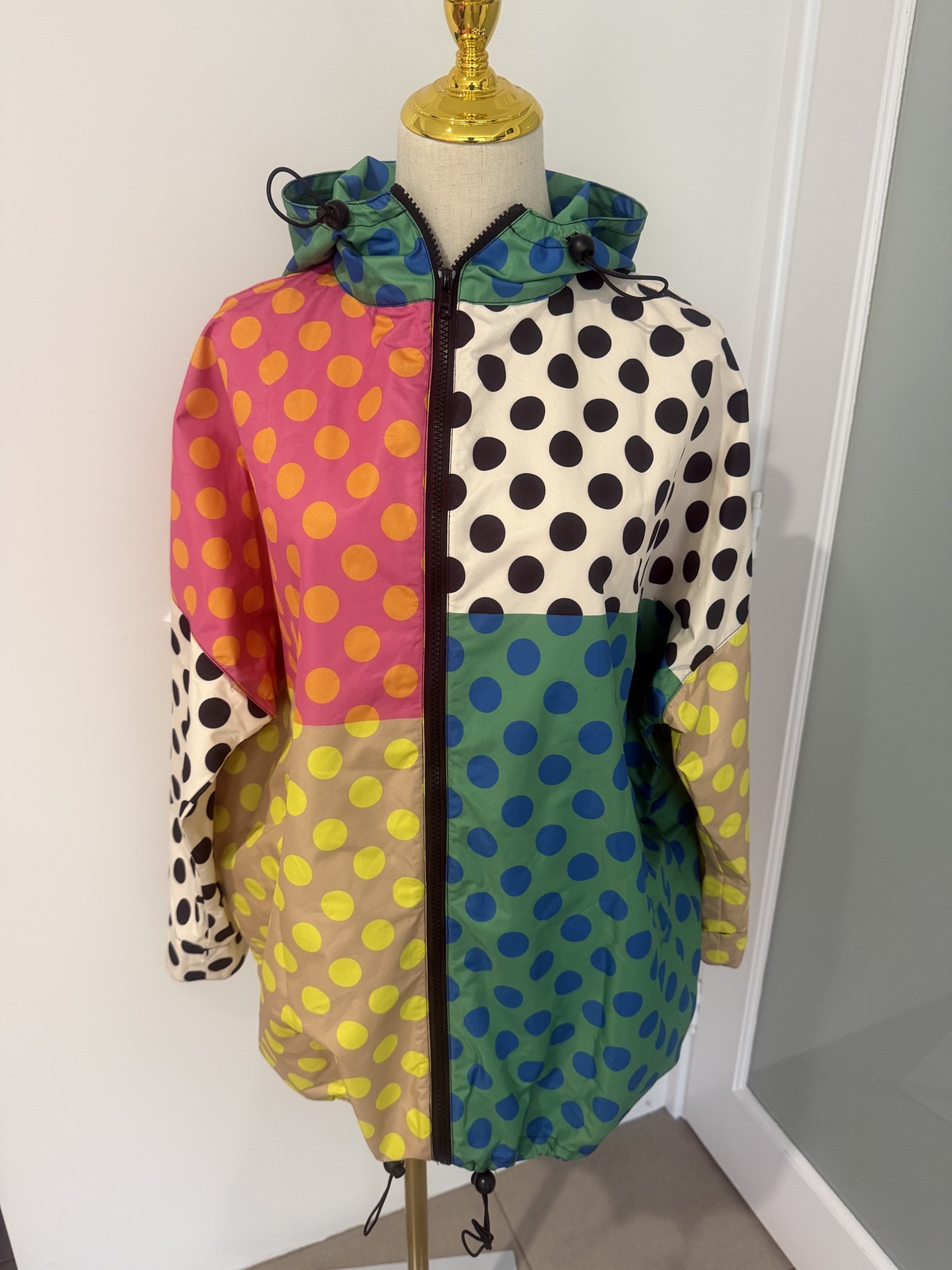 multi coloured raincoat. 