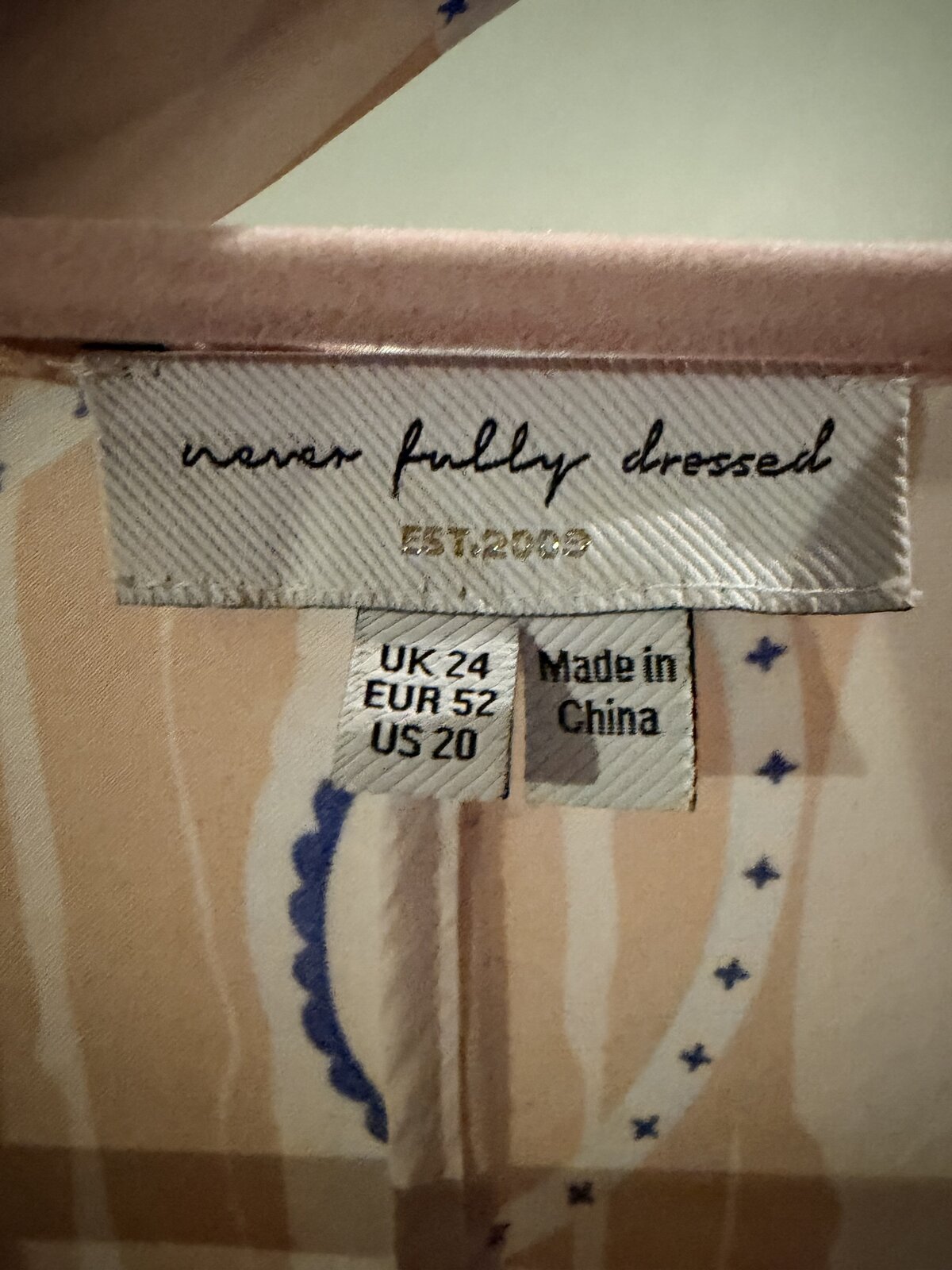 Tassel hem wrap dress cobalt tea pot print