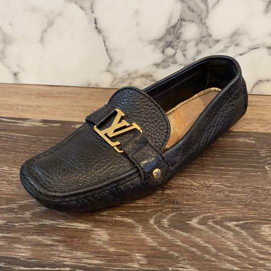 Louis Vuitton . Black Pebbled Leather Gold Lv Logo Loafers  display picture 1