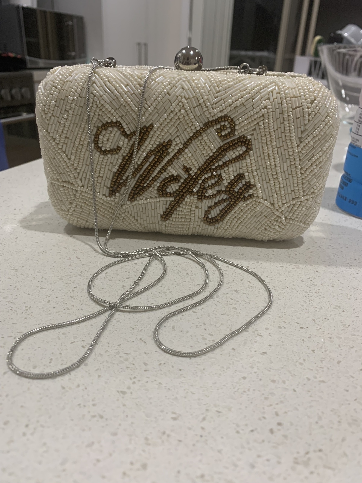 From St Xavier Wifey Medium Clutch Ivory Amber AirRobe